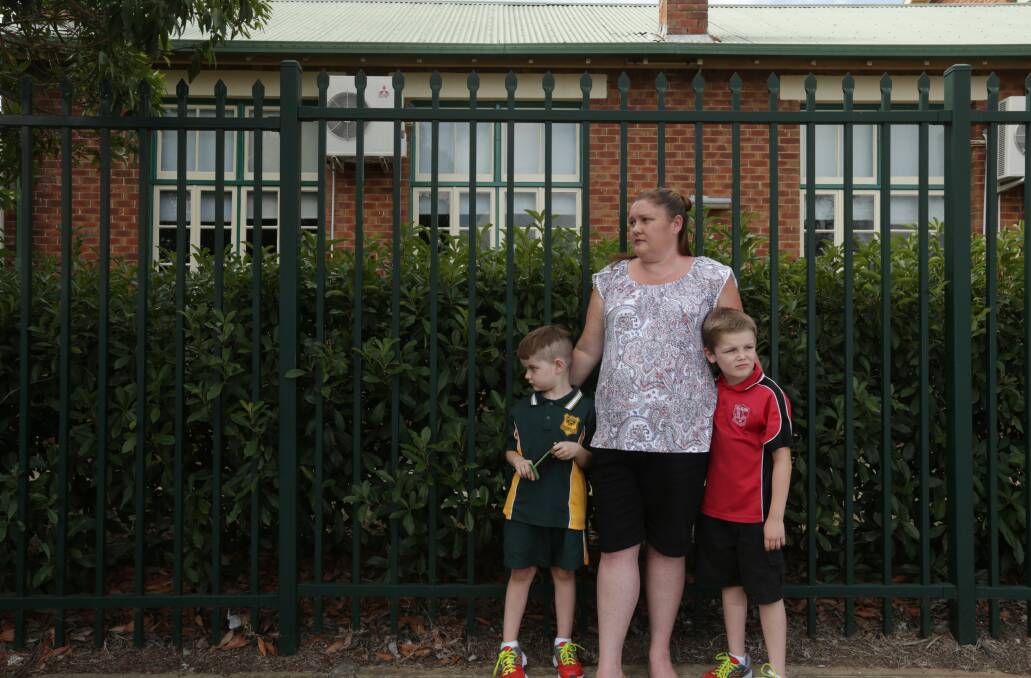 PROTEST: Tammie Spicer with her sons Callum Souter, left, who attends Cessnock West PS, and Riley Souter, right, who attends Ellalong PS. Picture: Simone De Peak