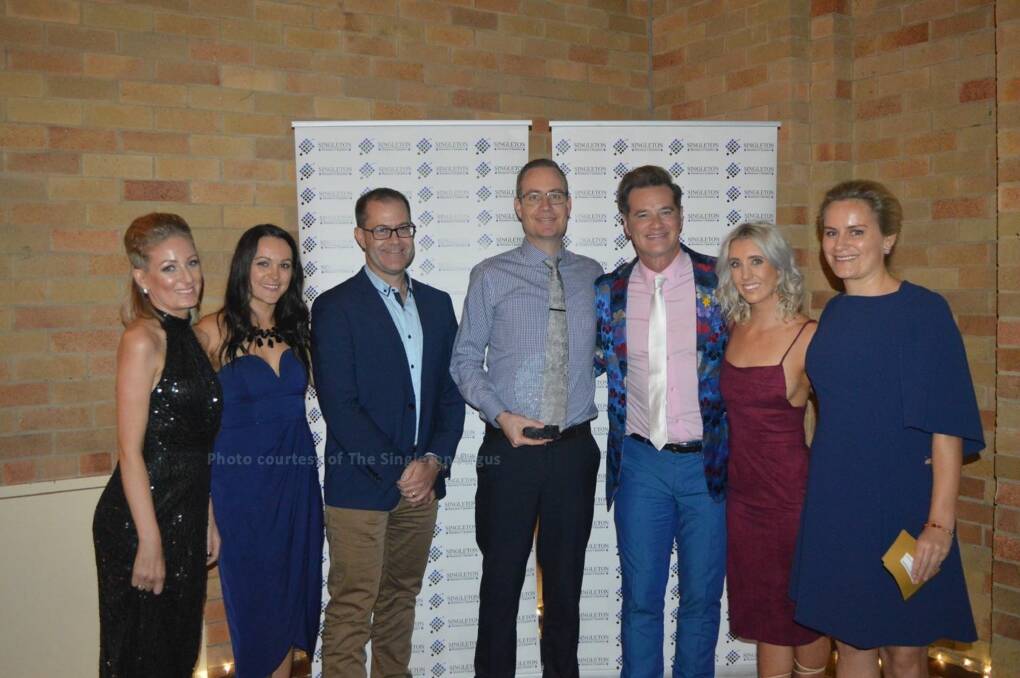 GALA EVENT: Staff from The Eye Place, which took out the Most Outstanding Business category in 2017, pose with guest speaker and Hollywood gossip guru Richard Reid.  