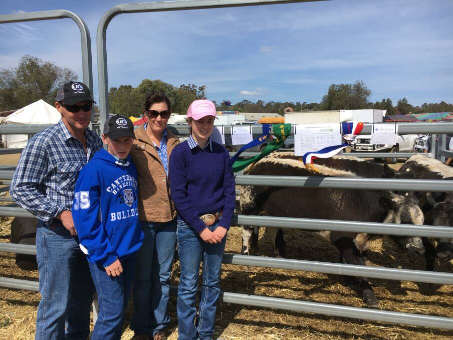 Jason and Tammy Nairne and their children Jack and Sarah with their winning pen of Speckle Park steer at the Merriwa Show Prime Stock competition.