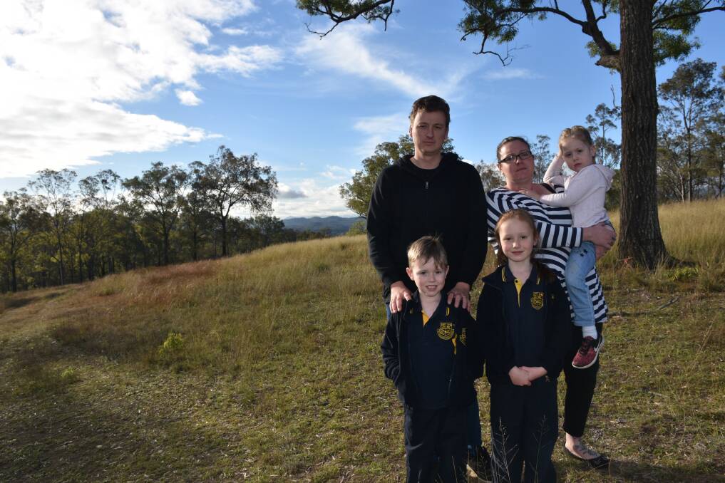 SHOCKED: Cameron and Miranda Hipwell with their children Dayne 6, Lilly 7 and Annabelle 4 on their block of land where they hope to build their family home.