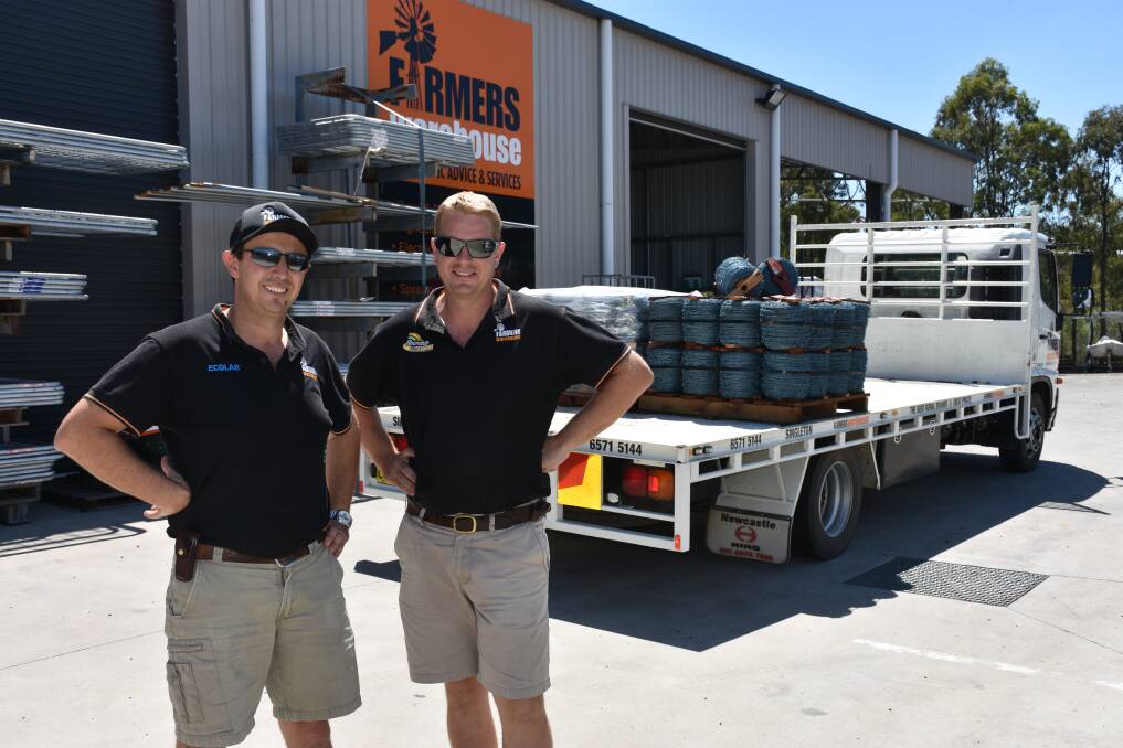 COMMUNITY SPIRIT: Farmers Warehouse, dairy business manager, Warren Baldacchino and managing director James Ramm readying the truck. 
