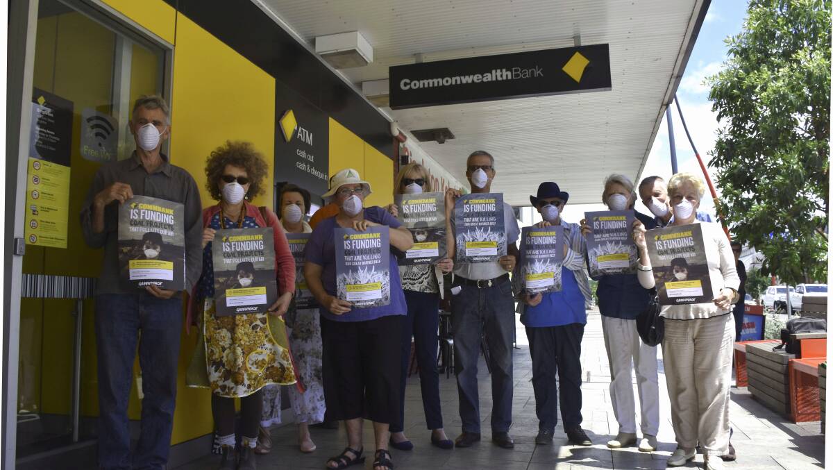 BAD LENDING: Protesters gather outside the Singleton branch of the Commonwealth Bank on Friday.
