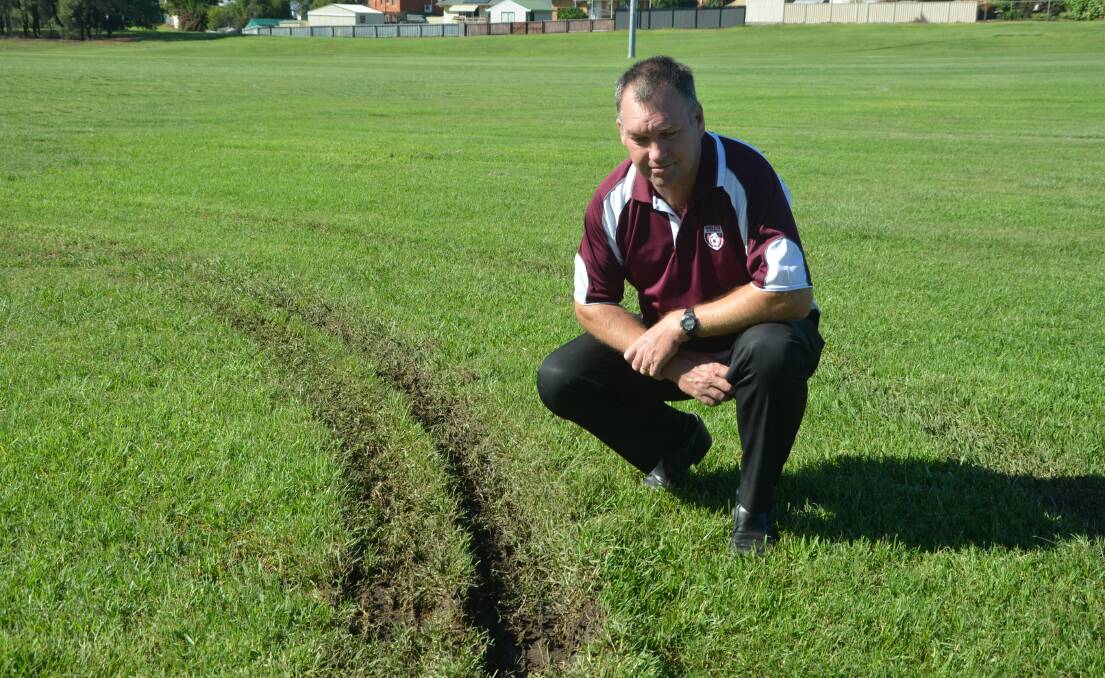 Singleton Strikers Football Club’s junior committee president Mark Henderson looks at the damage to Alroy Oval after the second vandal attack. Now the oval has been damaged for a third time.