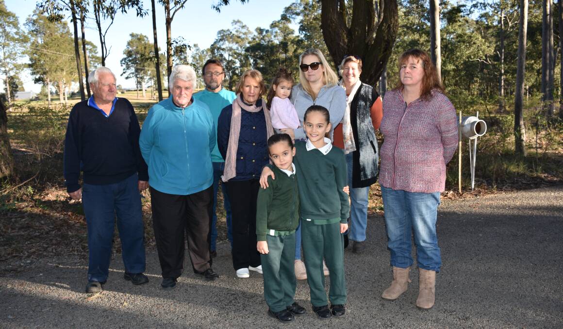 OPPOSITION: East Belford residents Les and Val Duggan, Brett Hassett, Kaye Hornery, Macey Hammat, Gini Matthews, Sue Wheelhouse, Mary Lind and sisters Peppa and Ayvah Hammat near the site of a proposed feed mill.