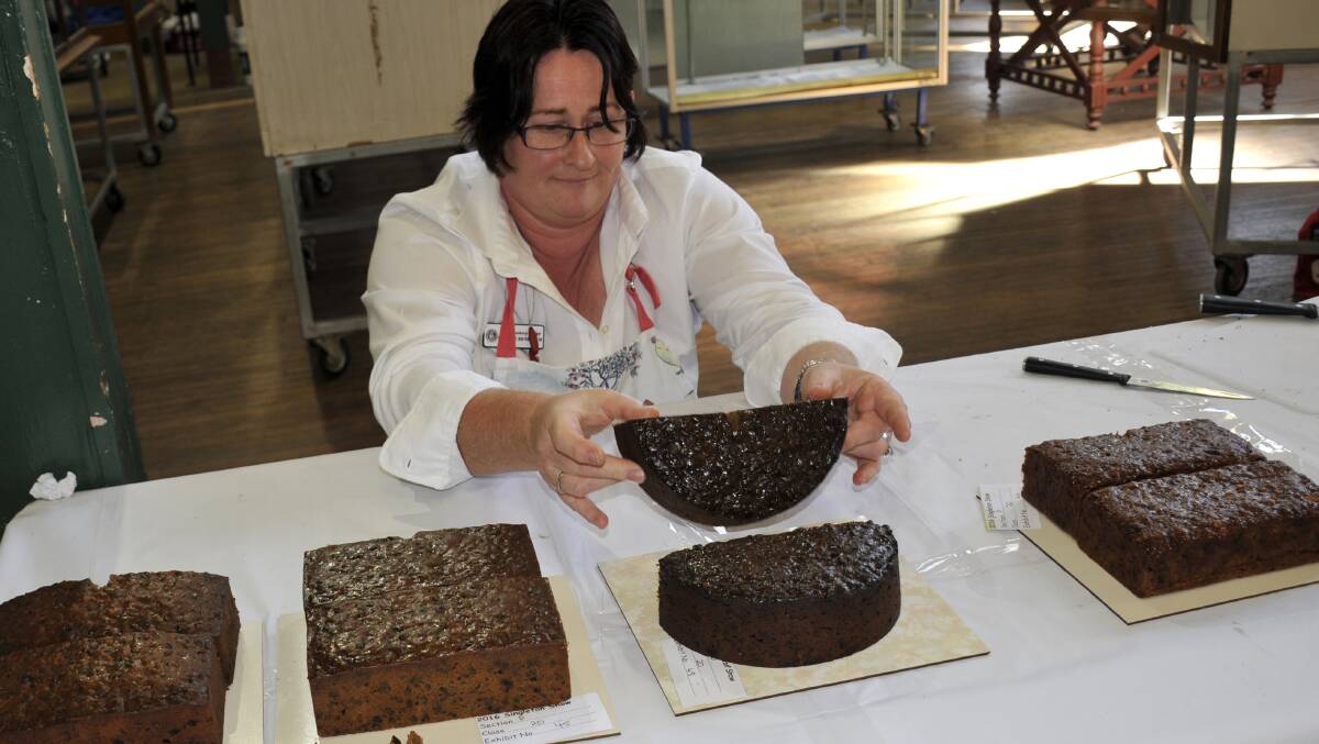 Leanne Bendeich judging the boiled fruit cakes at the Singleton Show.