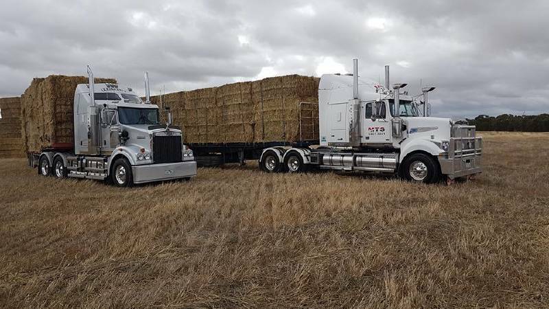  Trucks belonging to Hendy Transport and Maryborough Transport Services were loaded up on Sunday with hay donated by Victorians Chris, Barry and Shane Bibby, ready for another morale-boosting 2000km mission to Muttaburra. Photo source: Facebook.
