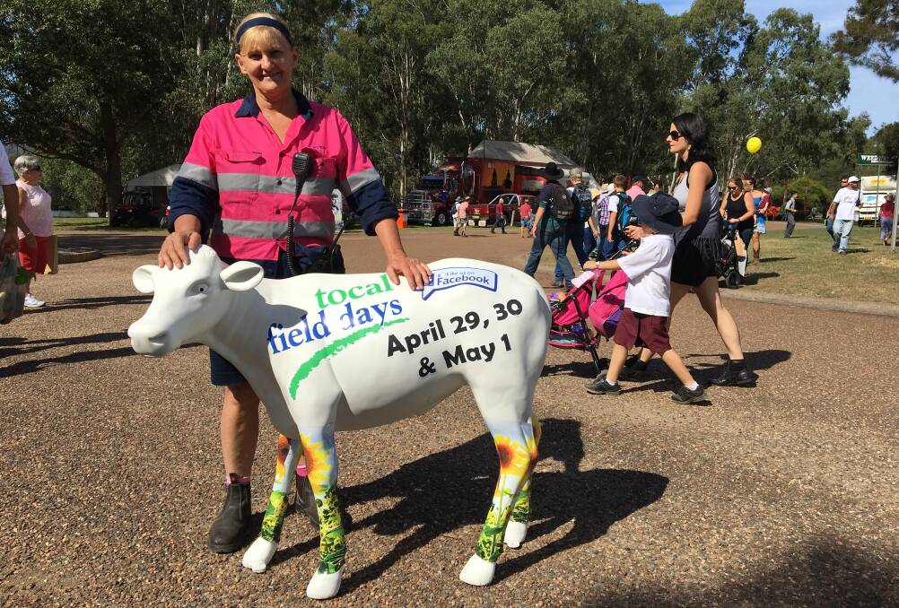DELIGHTED: Tocal Field Days manager Wendy Franklin and a colourful friend at the event on Friday. 