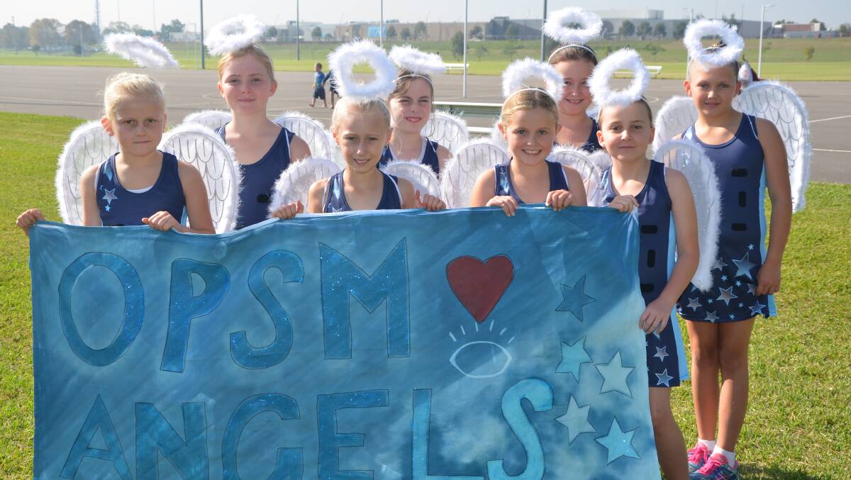 DRESSED FOR SUCCESS: Division 6 outfit OPSM Angels were ready for the Singleton Netball Association march past at Rose Point Park on Saturday morning.