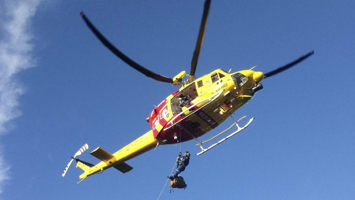 TASKED: The Westpac Rescue Helicopter was called to Milbrodale on Saturday night to attend to a 21-year-old man suffering burns to his back and legs.