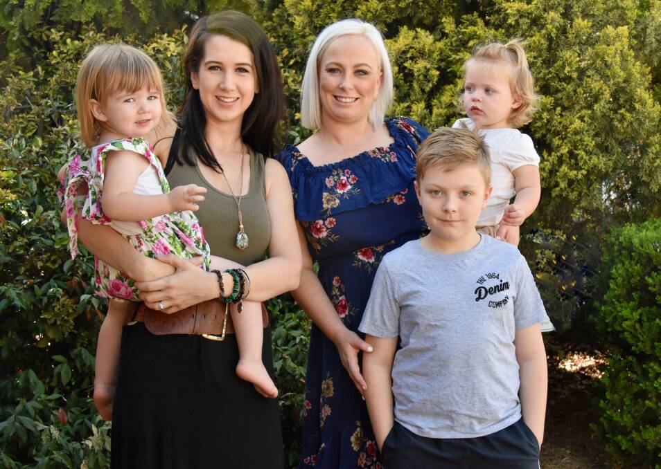 FAMILY FUN: Beth Scott holding daughter Anna and Kirsty Boag with daughter Annika and son Christian.  