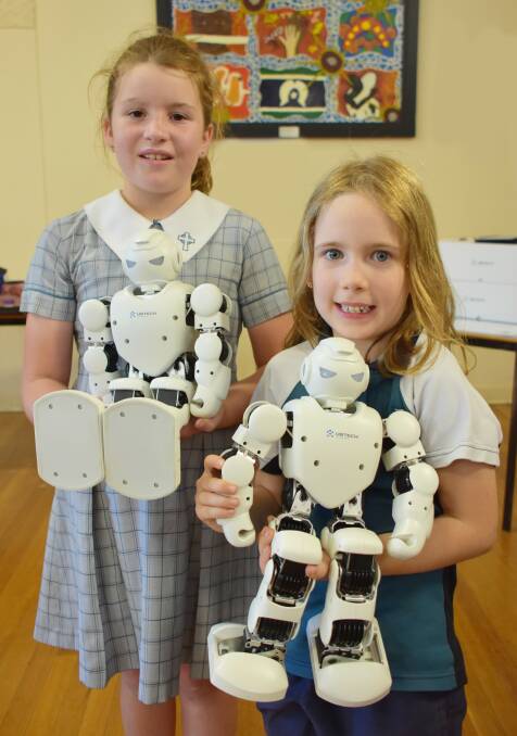 ROBOTS: Year 2 student Addi Eastley and Year 1 student Aurora Campbell. 