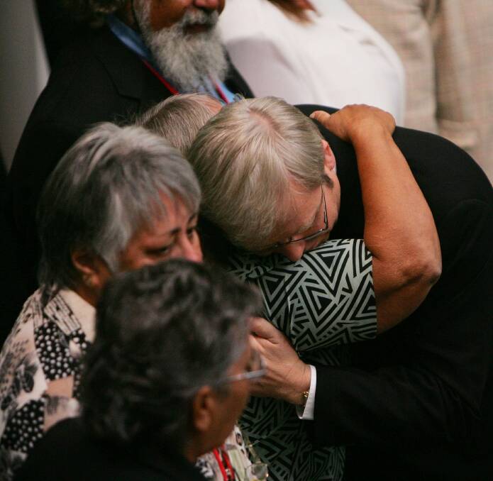 APOLOGY: Prime Minister Kevin Rudd hugs indigenous guests after his apology to indigenous Australian at Parliament House in 2008. Though just how much has changed following the apology? Photo supplied. 