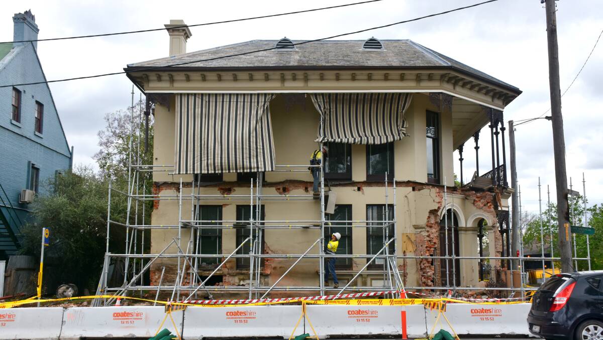 AFTERMATH: A historic home on the corner of George and Market Street has lost its balcony and suffered severe structural damage after yesterday's chaos. 