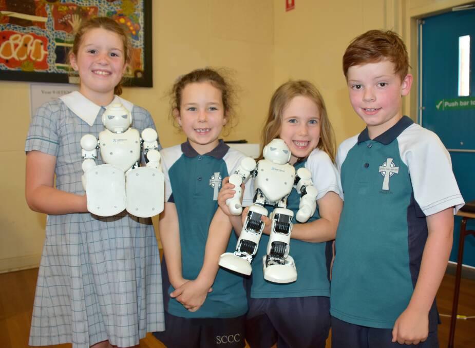 STEM: Year 2 student Addi Eastley and Year 1 students Chloe Goodwin, Aurora Campbell and Caleb Renfrey with the cleverly programmed robots.
