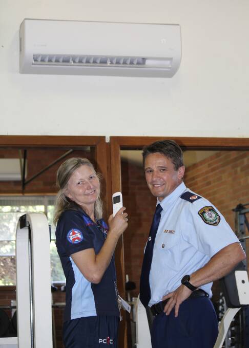 Vera Katris showing off air-conditioning with NSW Police Assistant Commissioner Jo Cassar.