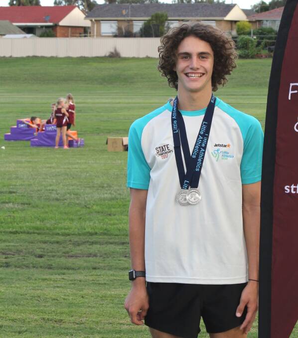 Ethan McLoughlin with his two silver medals, and he is now heading to the Asics Australian Little Athletics Championships.