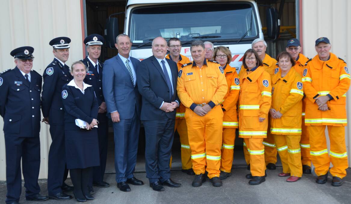 Scotts Flat RFS members with the Minister and local MP Michael Johnseo on Friday.