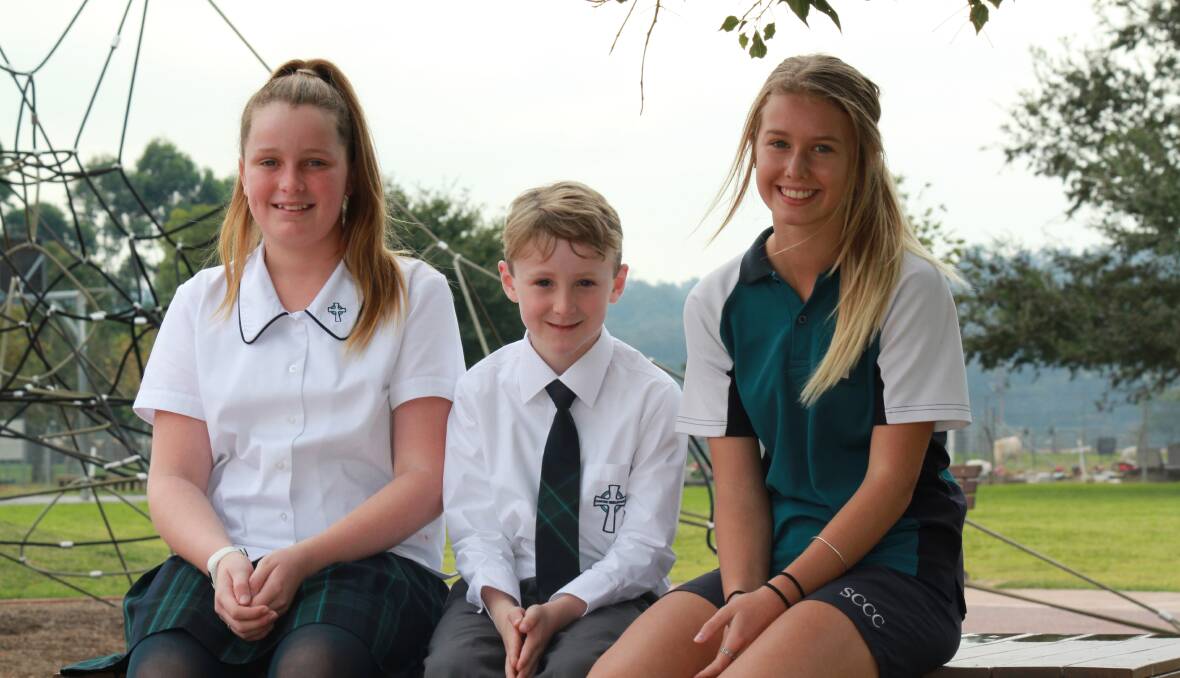 ALL SMILES: St Catherine's College students Grace Constable, Jonathan Davies and Chelsea Jupp enjoyed success in the competition.