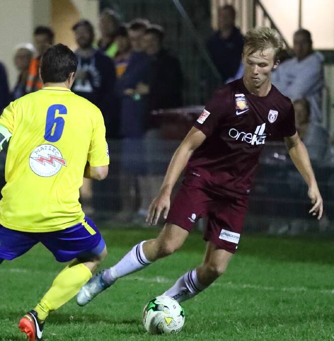 DRAW: Brad Millar in action during FFA Cup match and he scored equaliser for Singleton in surprise draw with Cooks Hill on the weekend.
