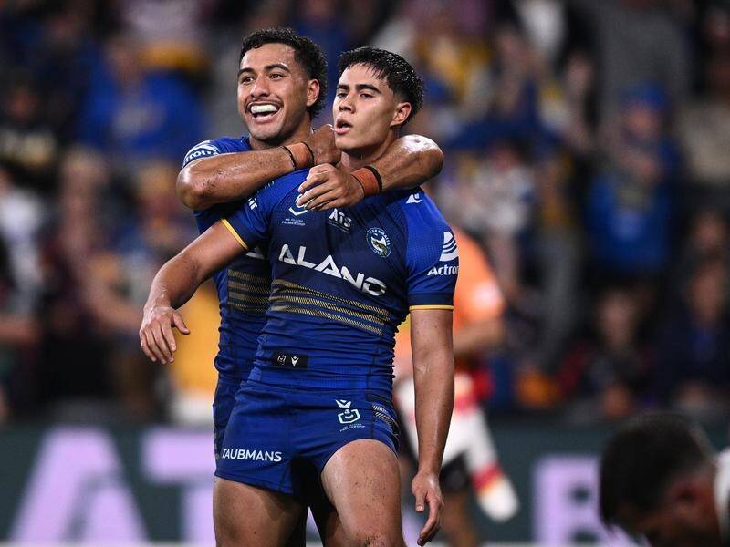 Blaize Talagi, grabbed by Will Penisini after scoring against the Broncos, may be a man in demand. (Dan Himbrechts/AAP PHOTOS)