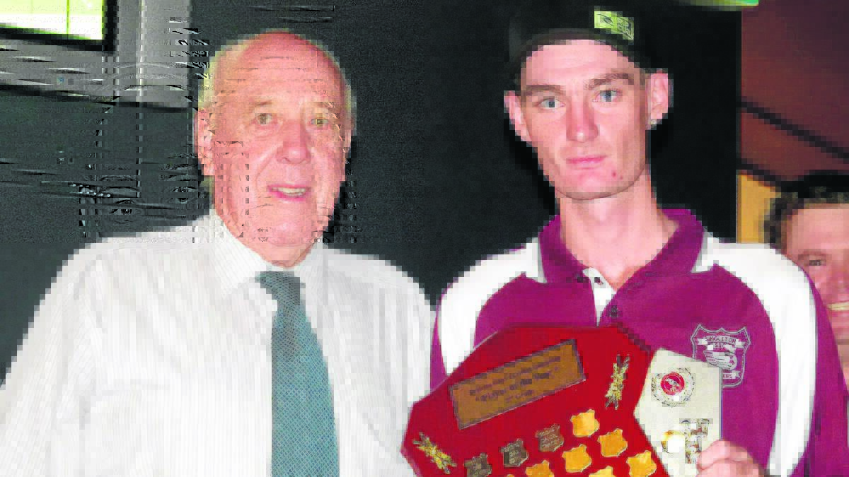 CONSISTENT:  Daniel Tracey (left) received the trophy for second grade player of the year from Mayor John Martin.
