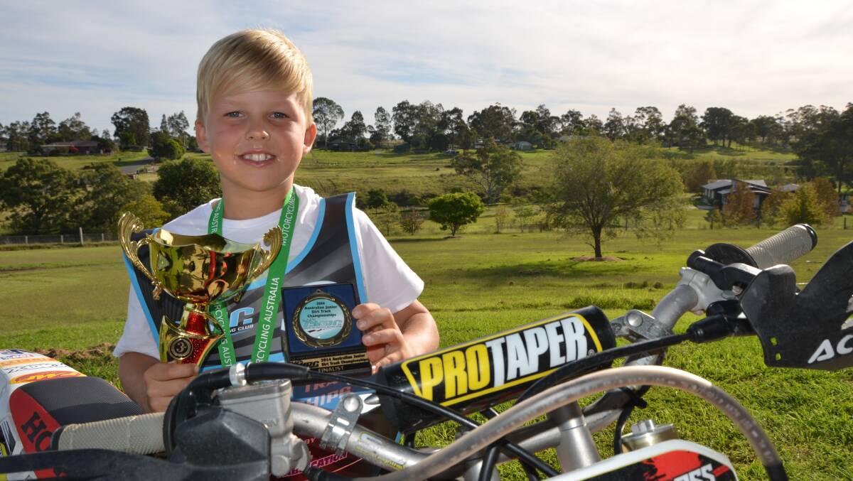 COMPETING WITH THE BEST: Ryan Smith with his third place trophy from the 2014 Australian Dirt Track Championships. 

