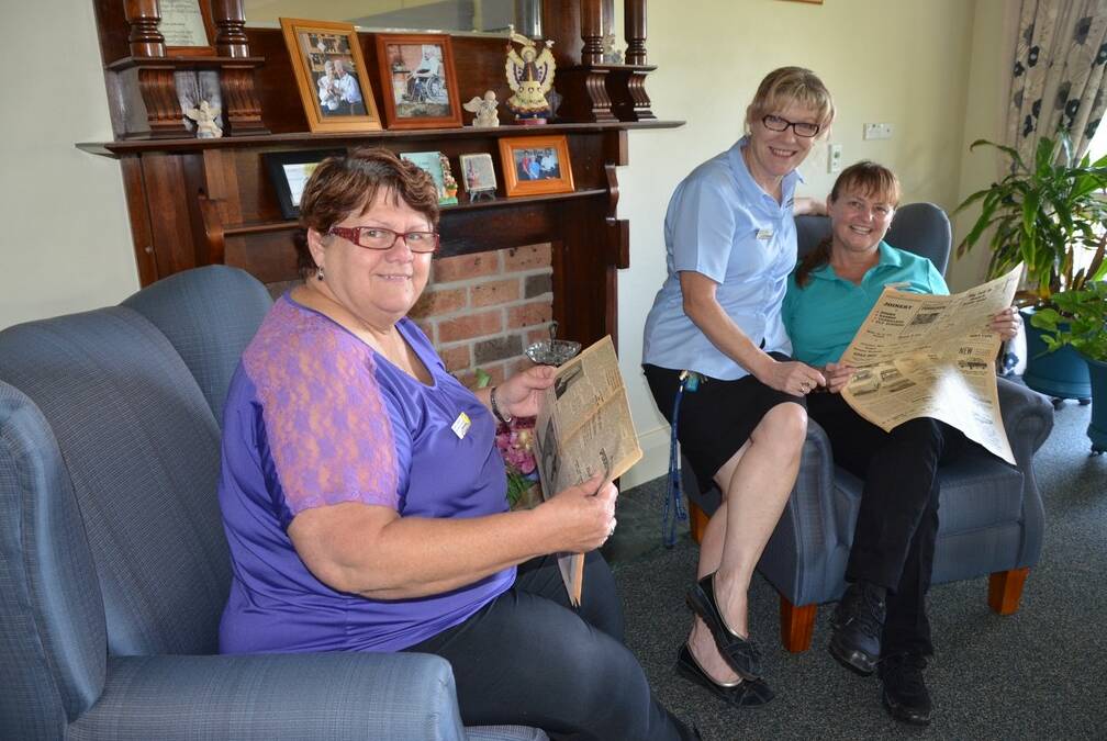 Service manager Carol Lyddiard, Barbara Reaks and lifestyle coordinator, Cathy Sheedy sourcing information from old copies in the Argus.