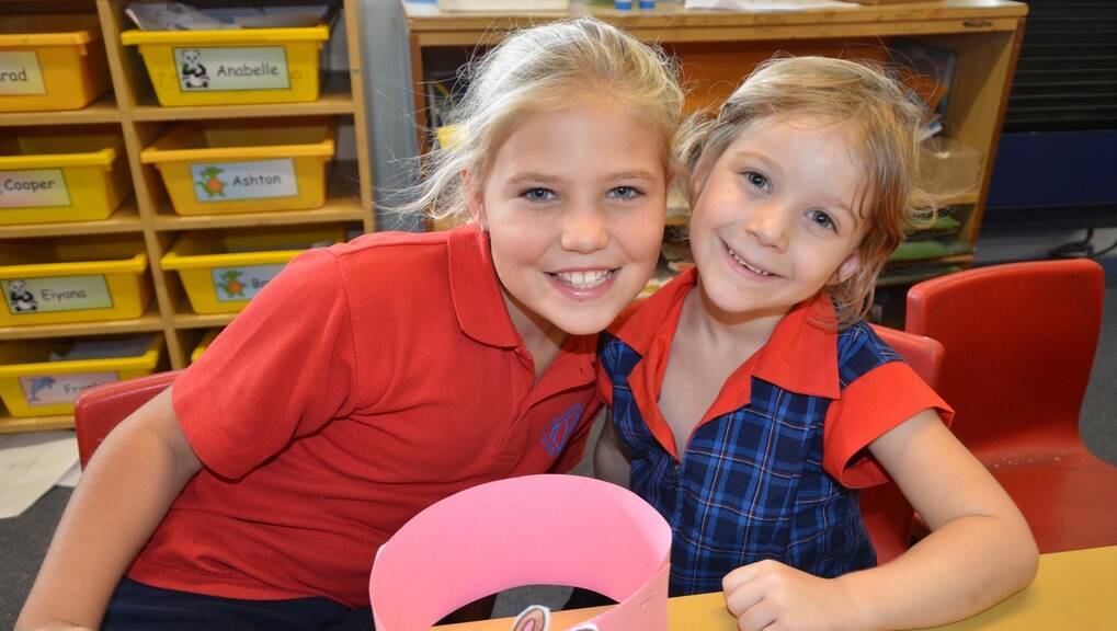 Year six student, Aimee Ford with her kinder buddy, Bronte Beagan.
