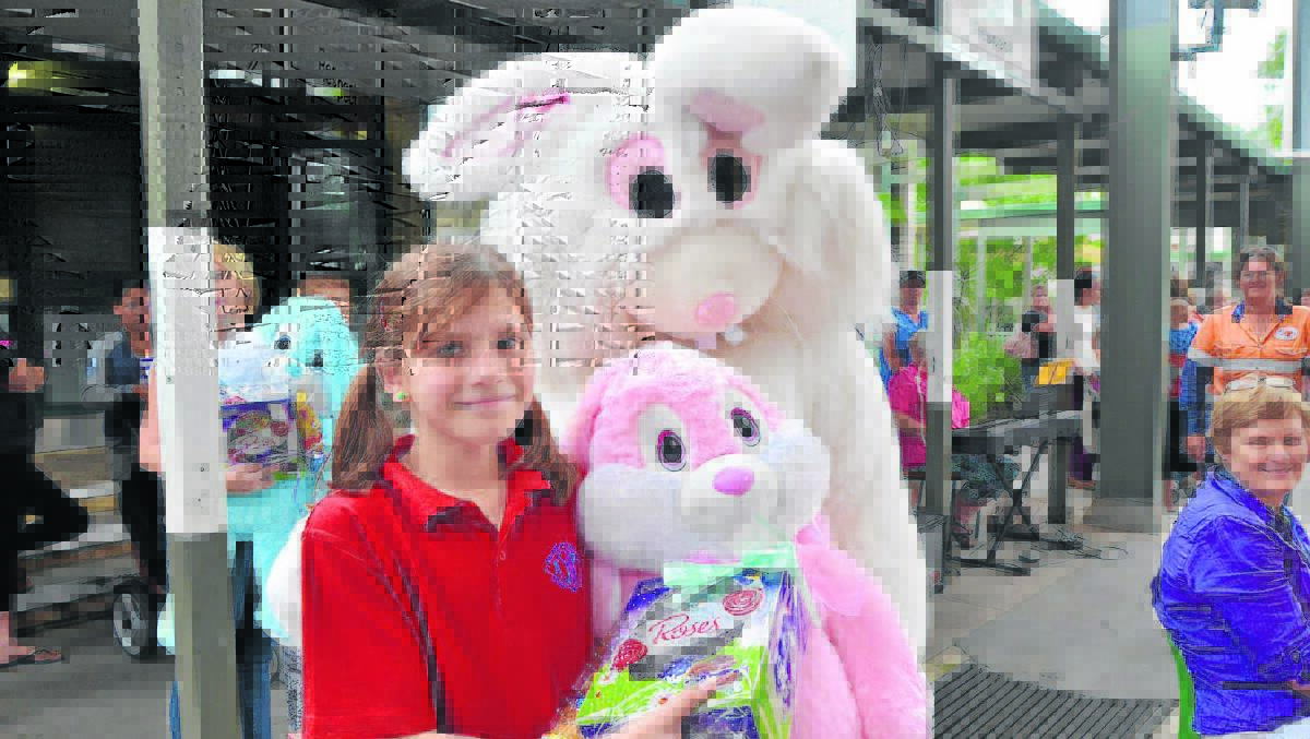 King Street's Julia Slatter accepting a prize from the Easter Bunny.