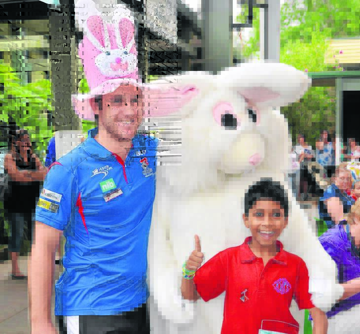Teacher Josh Ingramand with Rishab Kulani and Easter Bunny at King Street.
