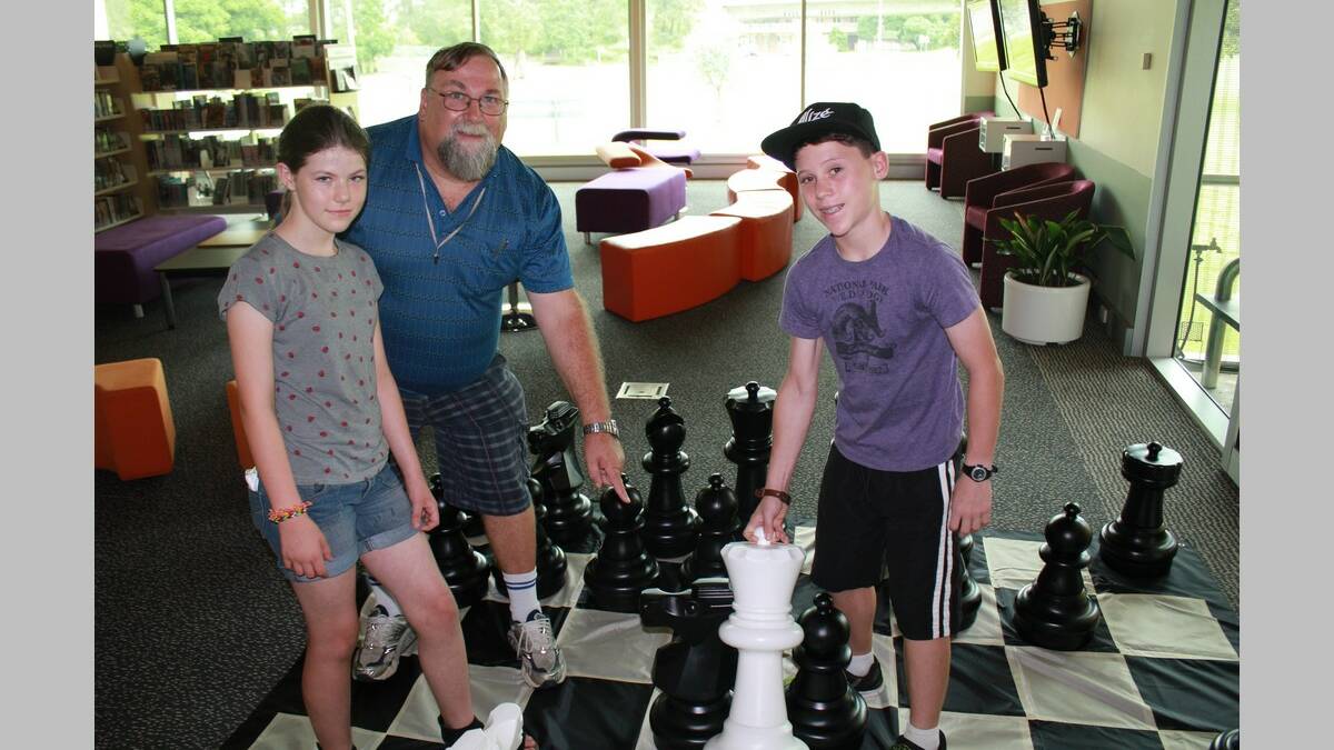 Brigid Fleming, Doug Wright and Jordan Donahue practise their skills at chess

