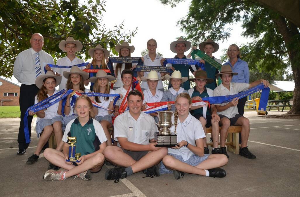 St Catherine's Catholic College students who are members of the schools cattle show team. (Back) College principal Brian Lacey, Brady Hunter, Brigid Thomas, Ashley Ernst, Taylah Hunter, Kyle Thomas Zac Henry and teacher Jo Towers. (Second row) Isabella Circosta, Isabel Empson, Abbi Paul, Kyle Hall, Matilda-Jane Sternbeck, Amelia Sternbeck, Caleb Hall and Josh Whiteman. (Front) Lucy Nichols, Rowan Vallance and Abbey Wilson.