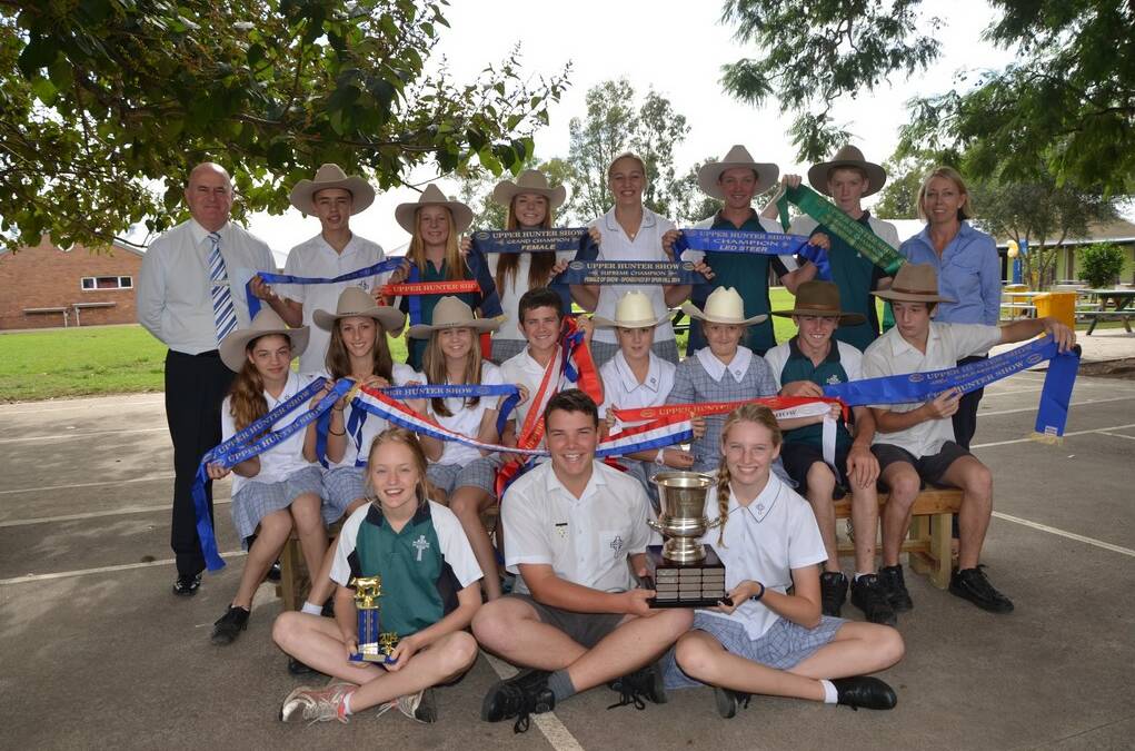 St Catherine's Catholic College students who are members of the schools cattle show team. (Back) College principal Brian Lacey, Brady Hunter, Brigid Thomas, Ashley Ernst, Taylah Hunter, Kyle Thomas, Zac Henry and teacher Jo Towers. (Second row) Isabella Circosta, Isabel Empson, Abbi Paul, Kyle Hall, Matilda-Jane Sternbeck, Amelia Sternbeck, Caleb Hall and Josh Whiteman. (Front) Lucy Nichols, Rowan Vallance and Abbey Wilson.