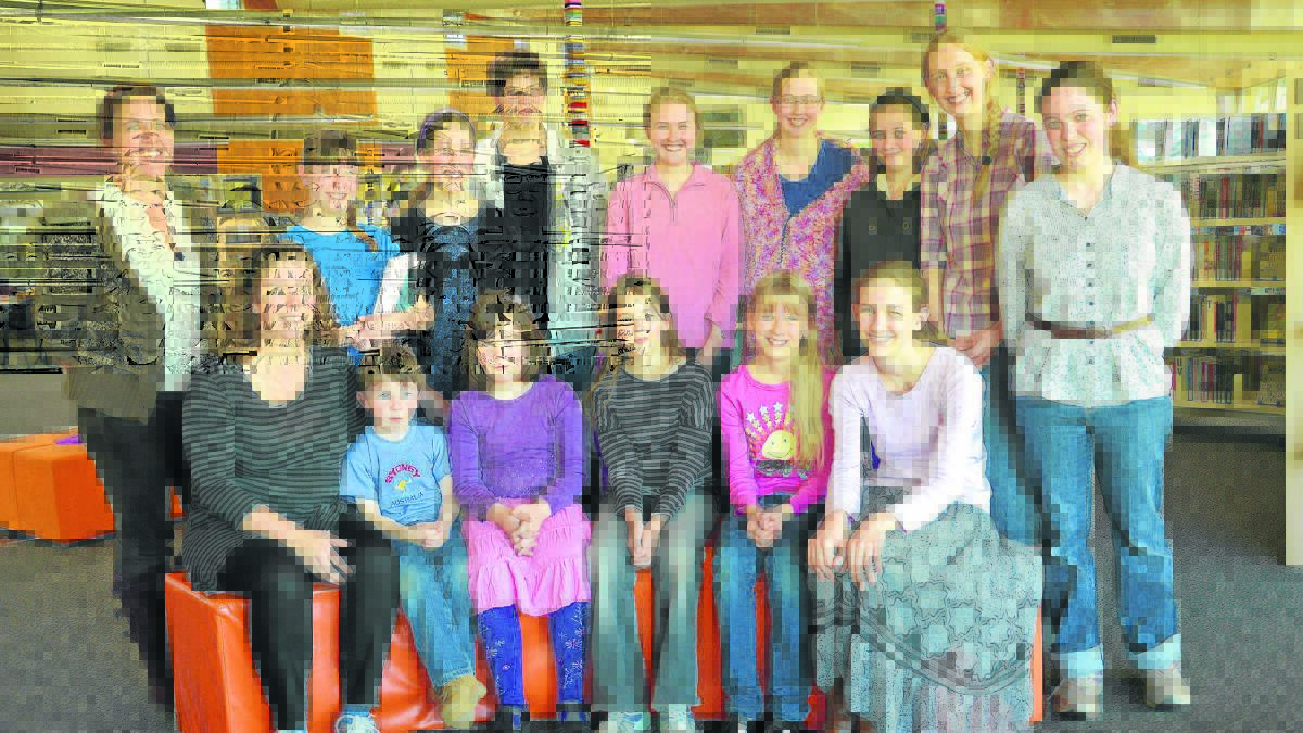 SUPPORTIVE ENVIRONMENT FOR LEARNING:  (Back left to right) Home school children Trudy Seibel-Barnes, Jane Farrelly, Alice Farrelly, Zach Seibel-Barnes, Bethany Dempster, Jessica Dempster, Clare Farrelly, (front) Sally Farrelly, Samuel Farrelly, Ally Seibel-Barnes, Jasmin Seibel-Barnes, Erin Dempster and Samantha Dempster at the Singleton Library last week.  