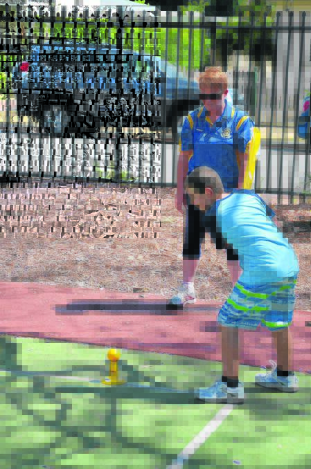 HITTING OUT: Jett Proctor launches into a shot, thanks to Rotary Dream Cricket.