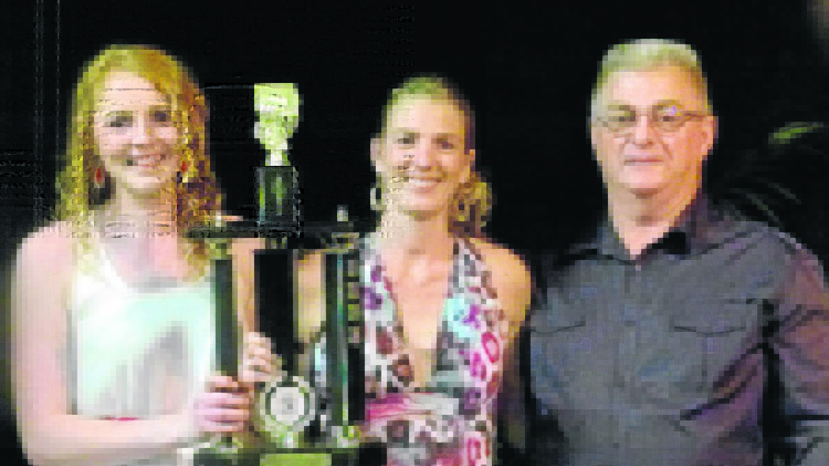 BIG YEAR: From left, Meghan Coffey, Tove Crosswell and Singleton Strikers inaugural president Steve Lawrence at Saturday night’s presentation.