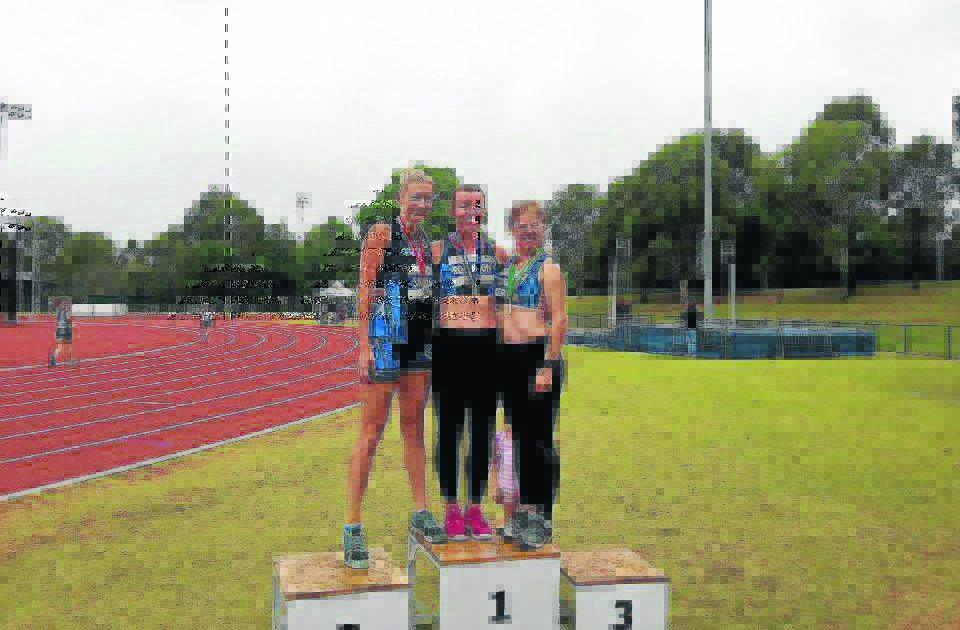 PODIUM FINISH: Nicole Robinson with her fellow competitors at the Masters National Athletics meet.