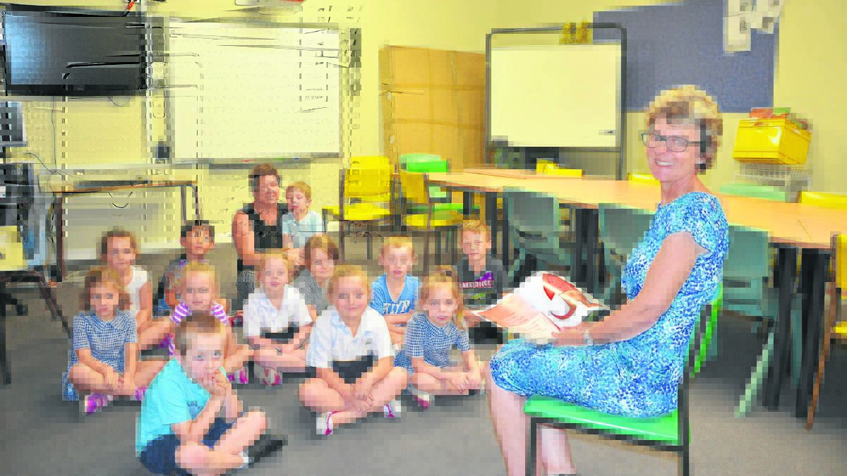 EDUCATIONAL: Singleton Public School teacher Gai Scoles and Alison Brown, student learning support officer, with some of the 2016 kindergarten students.