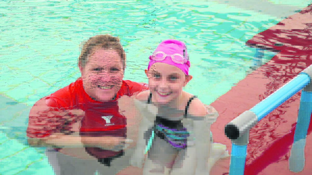 GOING FROM STRENGTH TO STRENGTH: Swimming coach Jacqui Ernst and Tomeeka Gould, who has benefited from the YMCA’s SwimAbility program.

