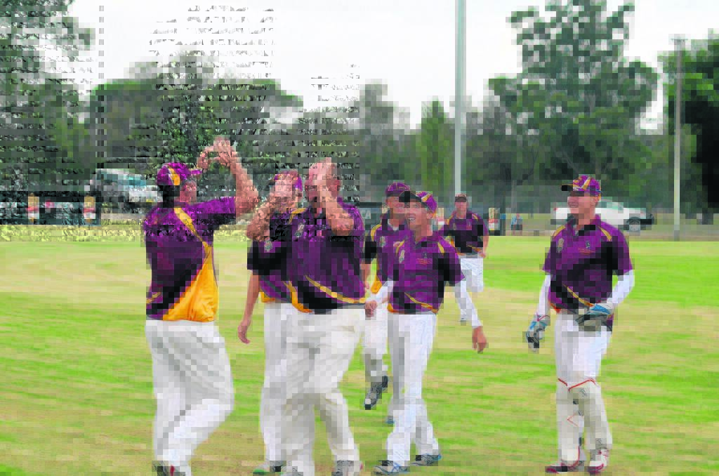 Locals celebrate another wicket.
