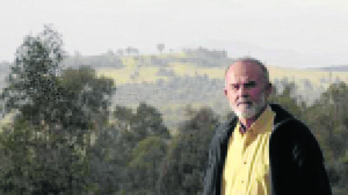 BITTERLY DISAPPOINTED: John Krey in front of Saddleback Ridge.Pic: THE NEWCASTLE HERALD