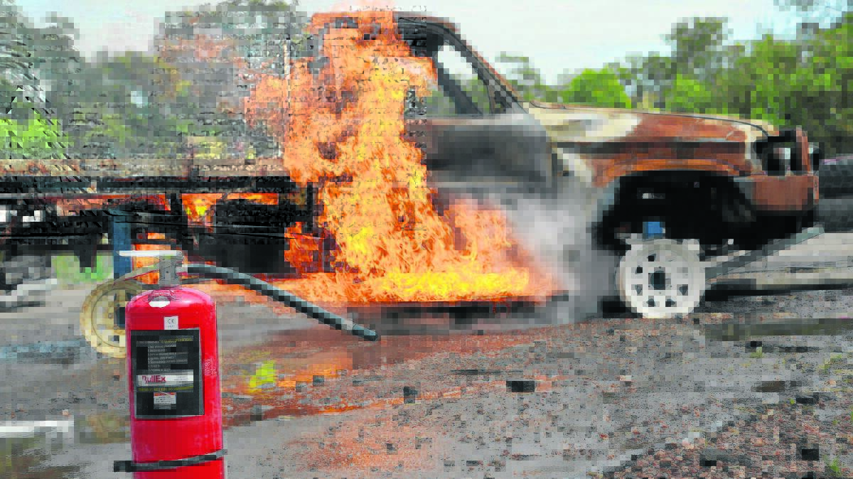 FIERY SIGHT: Emergency response miners work with Rural Fire-fighters had to extinguish a car fire and remove injured people from a second vehicle.