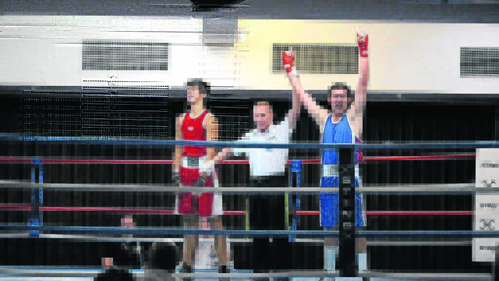 CHAMPIONSHIP DECISION: Brock McDougall (right) prevails in the Golden Gloves bout.