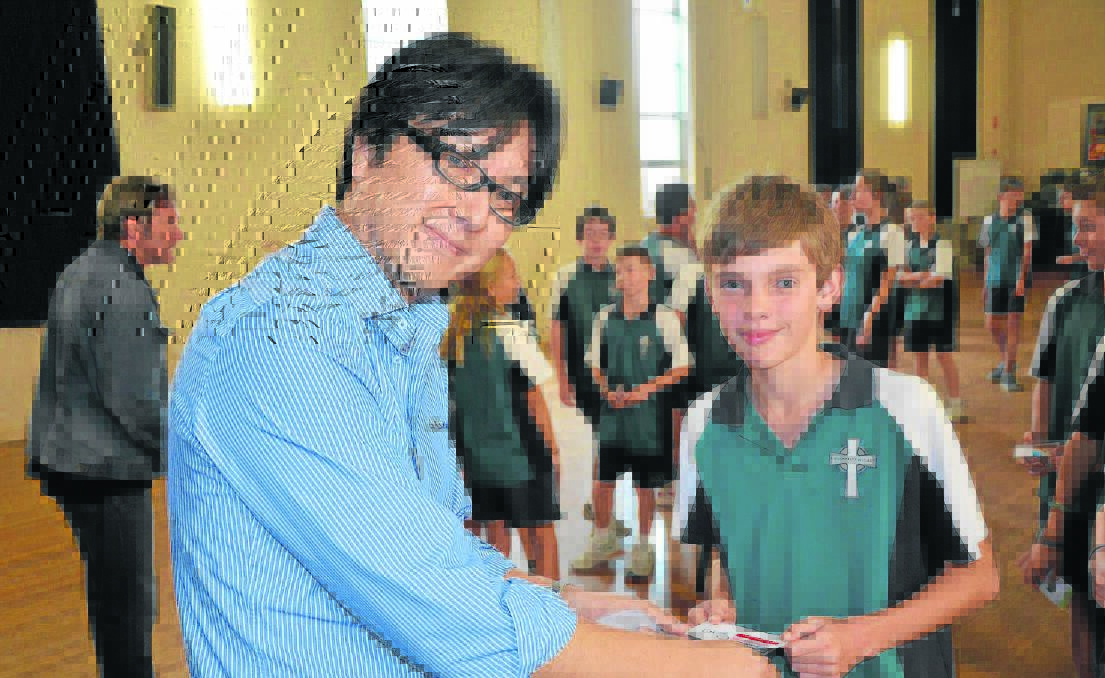 practical lessons:  general manager Rio Tinto joint ventures, Masaru Kobayashi greets Year 7 student Oran Marzol as they exchange business cards.