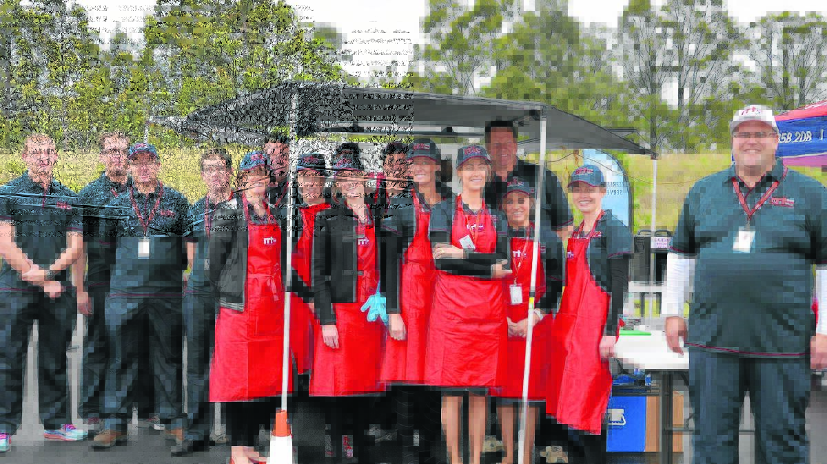 WHAT’S COOKING: Rapid Relief Team Singleton members – and team leader Bill Sealey (right) – prepare to feed a big crew, taking part in the 1200kms for Kids charity ride, at the Rixs Creek Rest Area last Wednesday.
