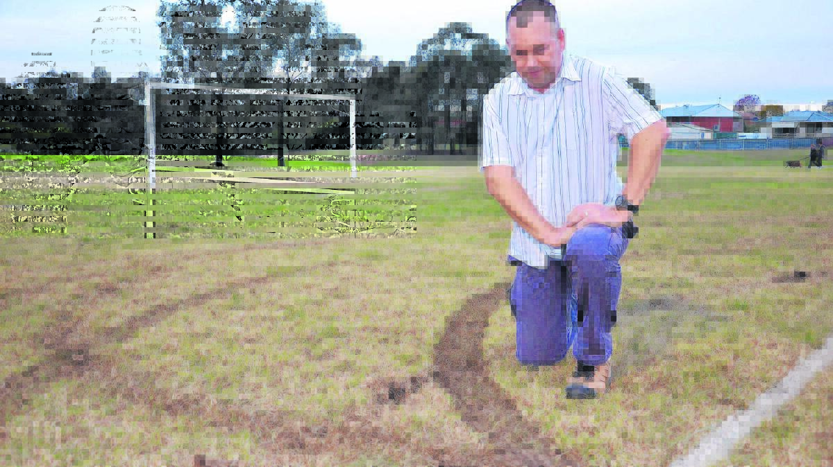 Mark Henderson surveys damage to Alroy Oval.