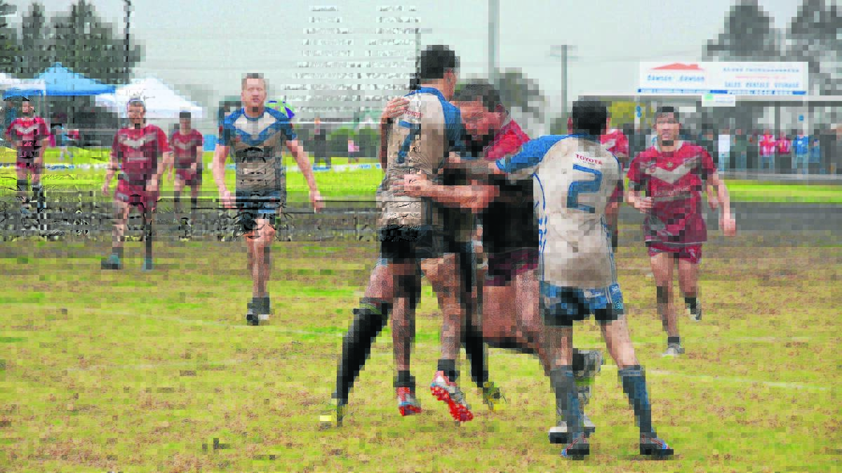 MUD RUNNER: Singleton Greyhounds front-rower Patrick Ling takes on the Scone Thoroughbreds in last Sunday’s Hunter Valley Group 21 reserve grade major semi-final. The Greyhounds trailed their rivals 16-0 at one stage, but stormed home to win 18-16, courtesy of tries to Brodie Rinkin, Jake Smith, Ethan Coe and Daniel Higgins, while Jake Mackaway landed a goal. Singleton will now meet either Scone or Greta Branxton in the 2015 decider on Sunday week. 

Pic: BEN MURPHY