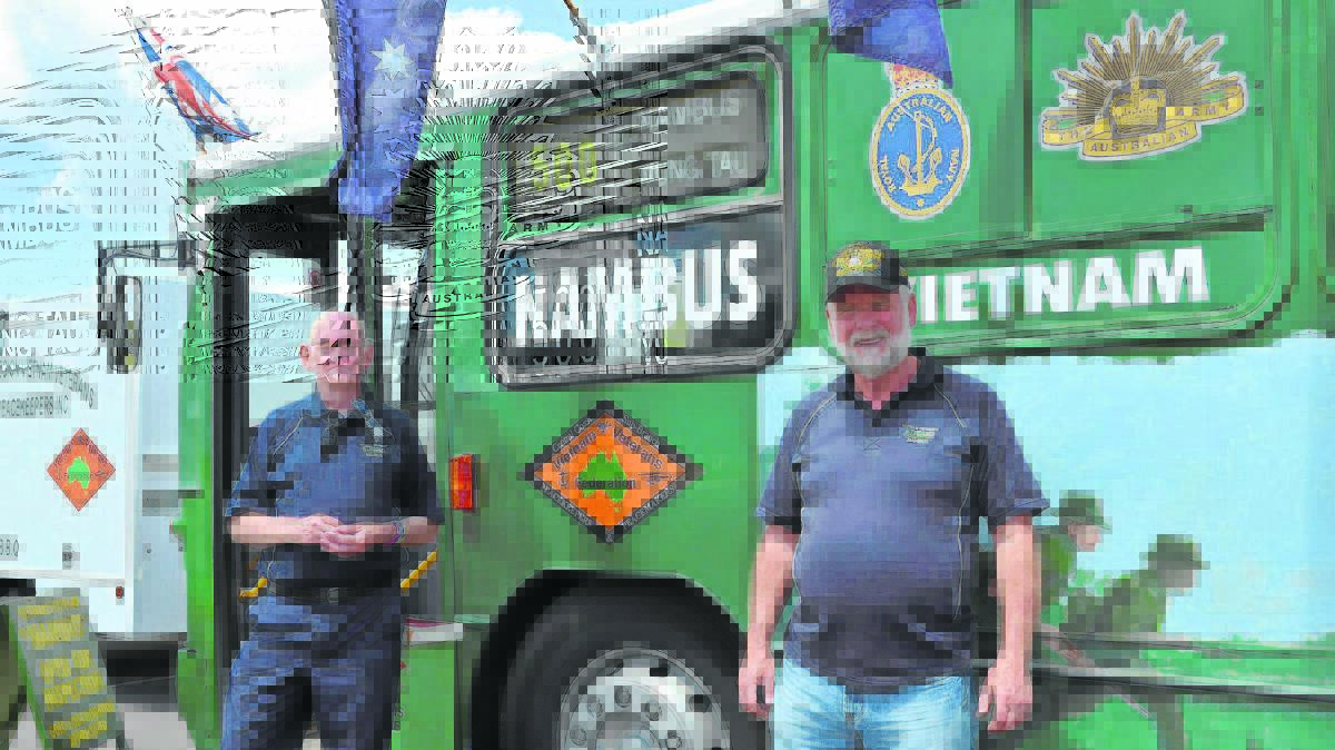 HOP ON BOARD: Ray Boddenberg (left) and Chris Stone outside the Vietnam Veterans Nambus at Saturday’s bi-annual All Things Military Expo – Now and Then, which was hosted by Australian Army Infantry Museum, Singleton.

