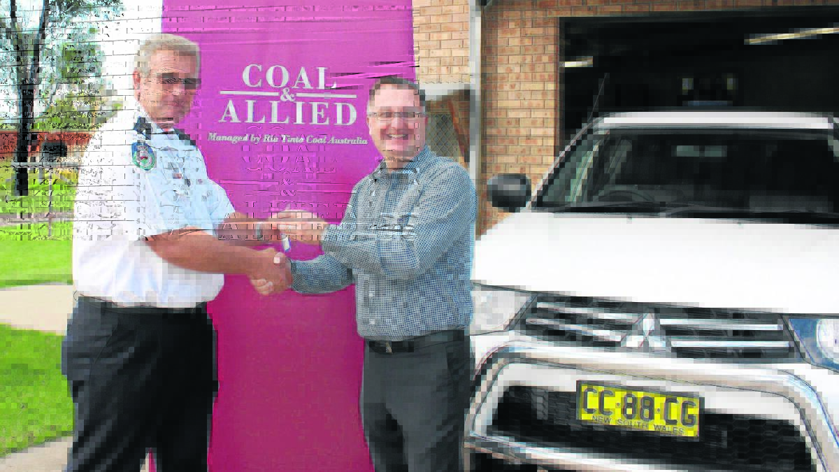 THANK YOU: Hunter Valley Rural Fire Service manager Paul Jones and Rio Tinto Coal Australia managing director Chris Salisbury with the new response vehicle.