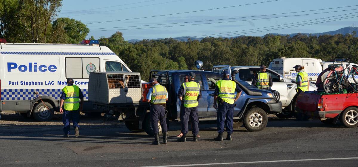 Police undertake routine checks on vehicles heading west on the Golden Highway.